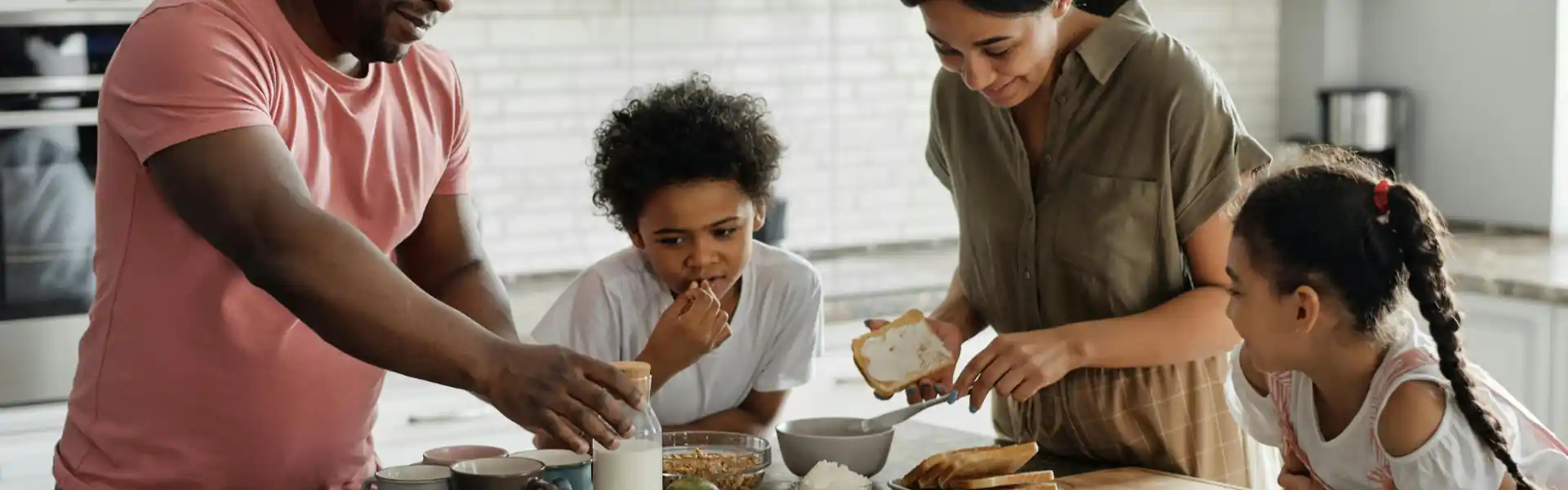 kids in the kitchen with parents cooking